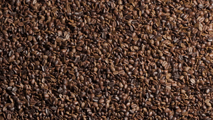 Top view of Coffee beans animation blown movement for transition isolate on green screen background. 3d animation.