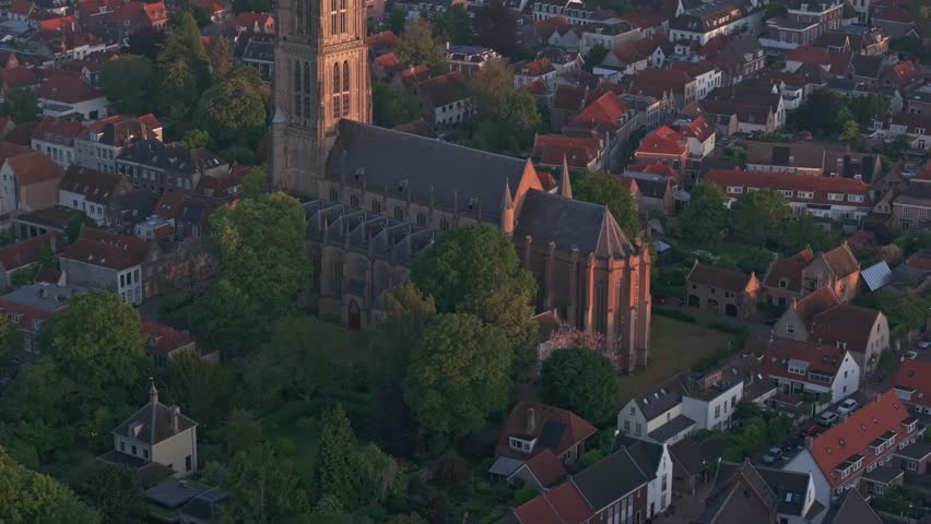 Aerial view of historic town with Sint-Maartenskerk church, river Waal, and cityscape, Zaltbommel, Netherlands.