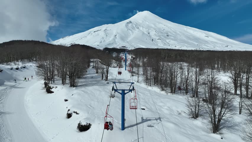 Ski Station At Villarrica Volcano Pucon Chile. Skier Skiing Downhill On Empty Ski Slopes In The Mountains. Outdoor Travel Destination Patagonia. Chair lift Snow Covered Aerial View. Pucon Chile.