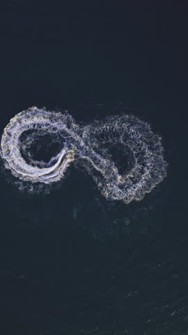 Powerboat turns loop number eight on the sea making infinity future concept 