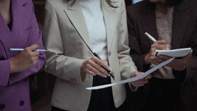 Businesswomen collaborating and analyzing a financial report. Emphasizing business strategy and financial planning concepts. Engaging discussions shape future decisions - Powered by Shutterstock - Get 15% off with code: PIKWIZARD15