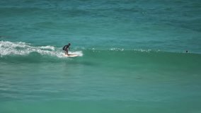surfers surfing at busy freshwater and manly beaches weekend school holidays - Powered by Shutterstock - Get 15% off with code: PIKWIZARD15