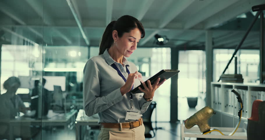 Woman, tablet or typing in office for research, medical knowledge or information in prosthetic development. Prosthetist, expert or happy with tech for innovation, feedback report or idea for project