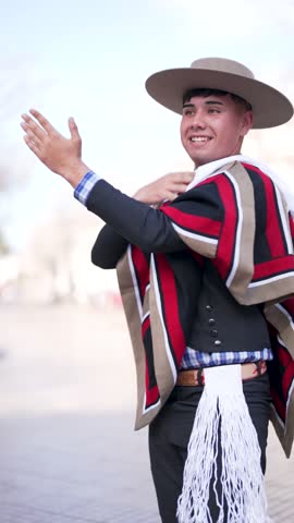 couple of huasos dancing Chilean cueca in the city square, Fiestas Patrias concept