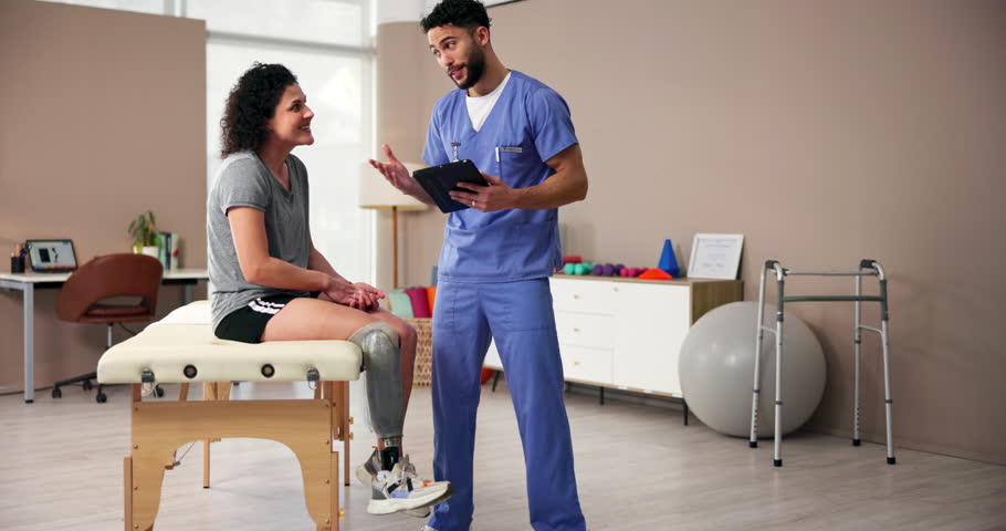 High five, prosthetic or tablet with patient and physiotherapist in office for recovery or rehabilitation. Explain, smile or success with amputee woman and consultant man in physical therapy clinic