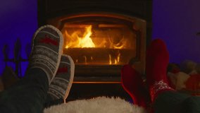A loving couple sits back and relaxes in front of a warm and inviting fireplace, enjoying a cozy and heartwarming moment together during this festive and joyful holiday season filled with love - Powered by Shutterstock - Get 15% off with code: PIKWIZARD15