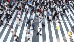 Aerial high angle view of crowd of people walking at the zebra crossing in Japan. Japanese people, ethnicity, population and diversity concept video. Blurred shot. - Powered by Shutterstock - Get 15% off with code: PIKWIZARD15