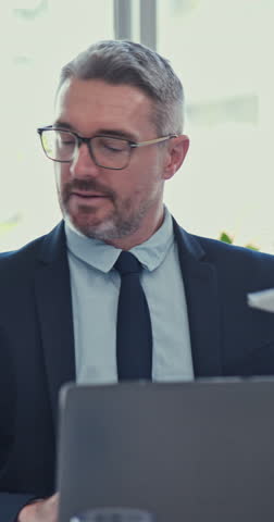 Business, mature man and overwhelmed with multitasking at office with chaos for deadline. Male person, technology and frustrated with paperwork as ceo or leader with stress, anxiety and crisis
