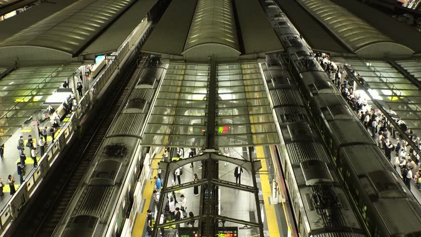JAPAN : View of crowd of people at the train station in busy night rush hour. Japanese people, commuters and transportation concept video. Time lapse shot.