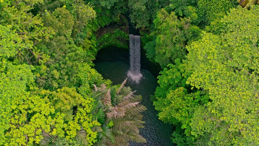 Beautiful Tibumana Waterfall on nature background. Bali, Indonesia