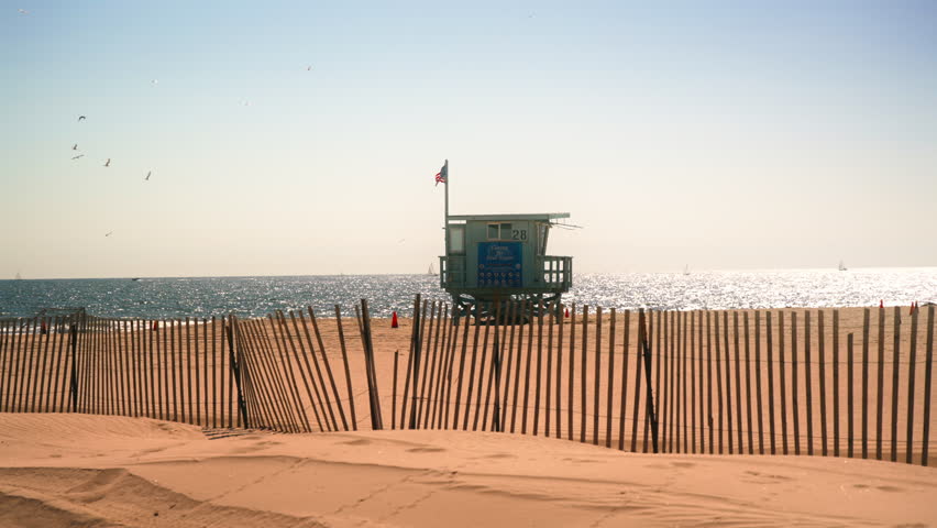Life guard tower on an empty Venice Beach in Los Angeles during a sunny day with clear sky