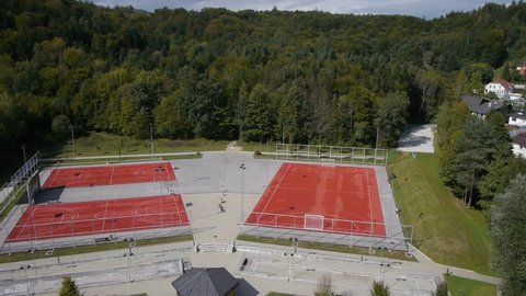 Flight over a children's playground, basketball and football court