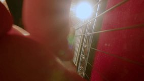 Hands of unrecognizable guitarist using plectrum while playing electric guitar on stage. Extreme close-up shot - Powered by Shutterstock - Get 15% off with code: PIKWIZARD15