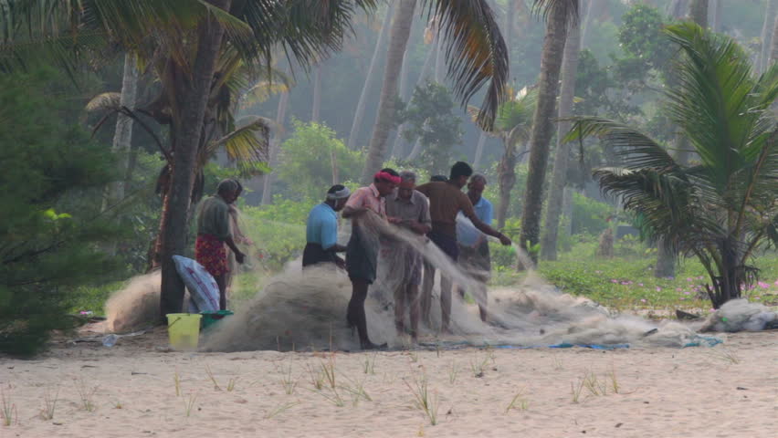 ALLEPEI, INDIA - DECEMBER 04, 2012: Fishermans preparing fishnets for fishing in