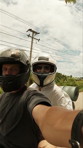 Vertical Selfie of Couple Riding a Motorbike in the Mountains of Northern Thailand, Travel Adventure, Romantic Journey, Exploring Scenic Landscapes Concept