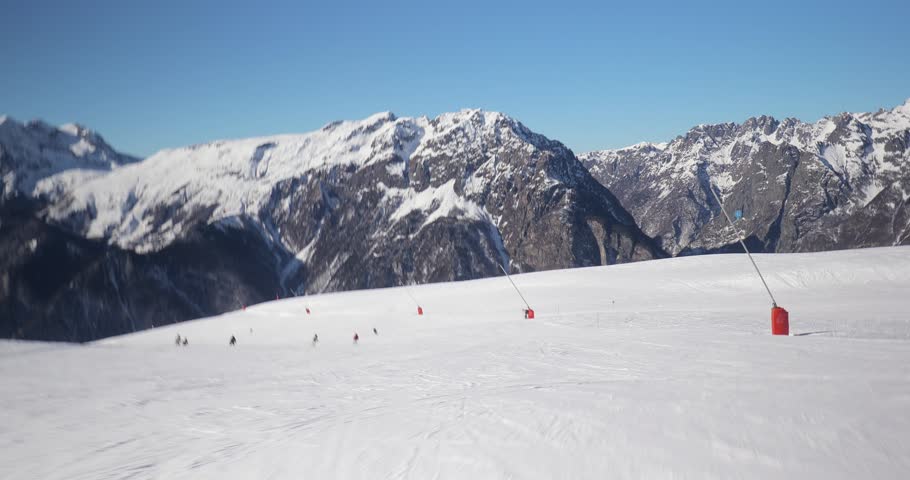 Skiing slope in the French Alps, ski POV view, Alpe d'Huez, sunny day, First person point of view on the ski run, going fast downhill