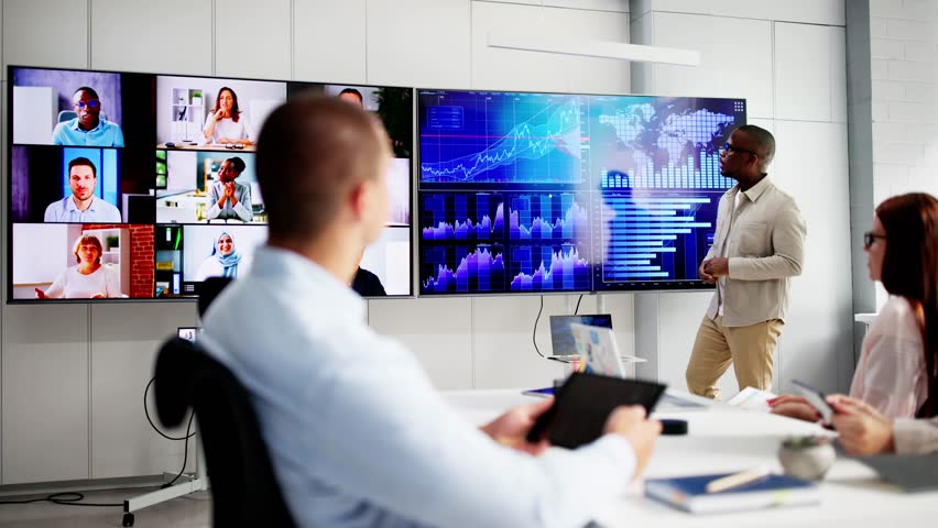 Business Presentation In Meeting Room. People Looking At Dashboard