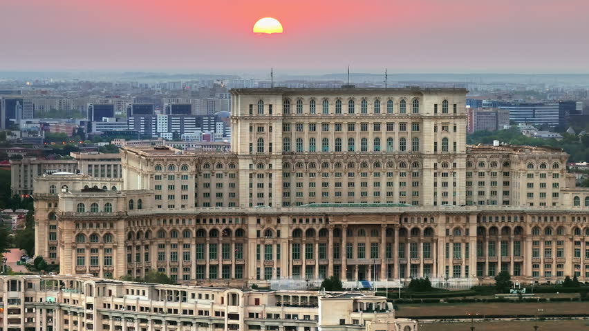 Aerial drone view of the Palace of Parliament in Bucharest, Romania at sunset