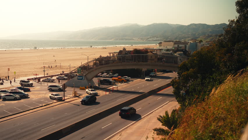Traffic on Pacific Coast highway in Santa Monica, Los Angeles, California during a sunny day with clear sky