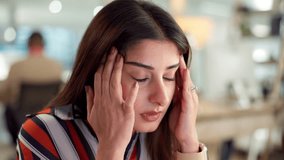 Headache, woman or tired in office for finance, company debt and burnout in business. Female administrator, frustrated or anxiety in workplace for budget crisis, stress or massage temples for relief - Powered by Shutterstock - Get 15% off with code: PIKWIZARD15