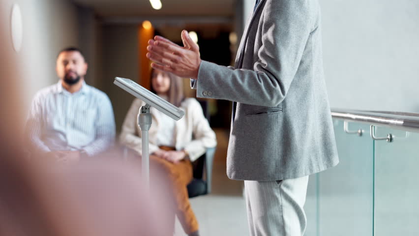Hands, man and talking on press conference at office for briefing, communication and media update. Business people, leader and feedback with announcement of news on company growth and manage crisis