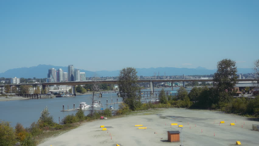 Summer view of Vancouver City harbour, bridge and downtown. Slow motion.