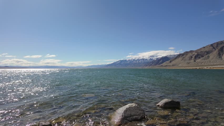 Shoreline of walker lake in nevada with snow covered mountains