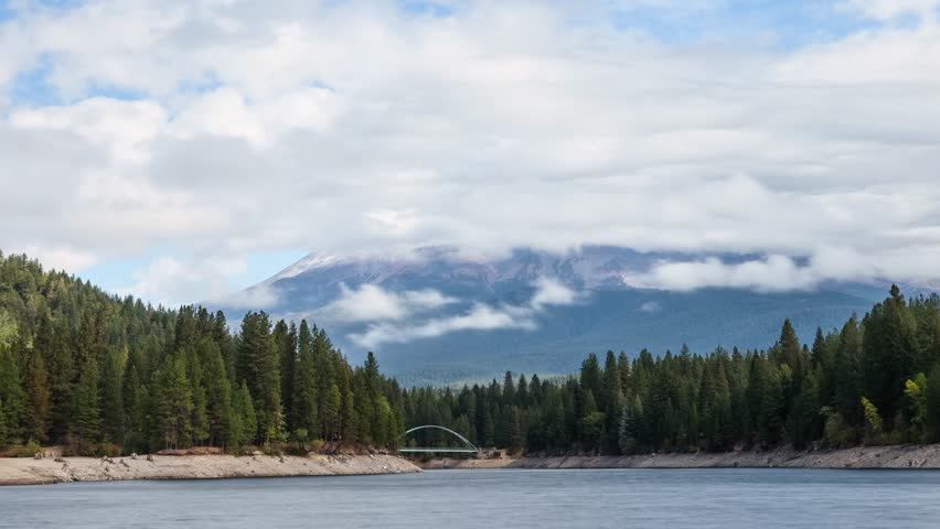 Time lapse looking out over Lake Siskiyou to the clouds surrounding the volcano Mount Shasta in Northern California.
