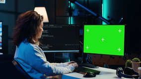 Freelancing admin using green screen computer monitors to filter malicious traffic from cybercriminals attempting to corrupt company data. IT expert in apartment working on mockup desktop PC, camera A - Powered by Shutterstock - Get 15% off with code: PIKWIZARD15