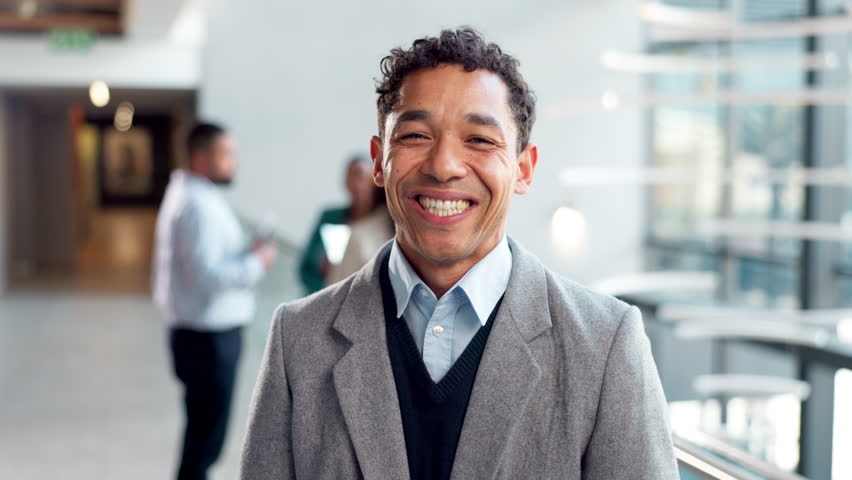 Smile, professional and convention with face of man at business expo for networking, development opportunity and corporate venture. Conference, key note speaker and pride with person for mission