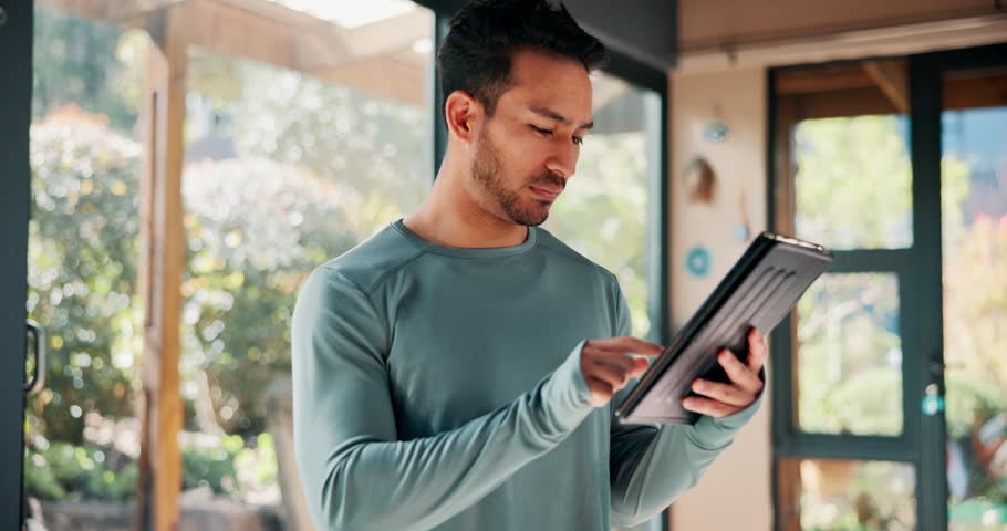 Exercise, coach and man with tablet in gym for workout, planning or digital schedule of class. Happy, person and personal trainer with tech at health club for fitness, website or online training tips