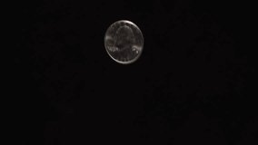 US Quarter Flipping in Close-Up - Powered by Shutterstock - Get 15% off with code: PIKWIZARD15