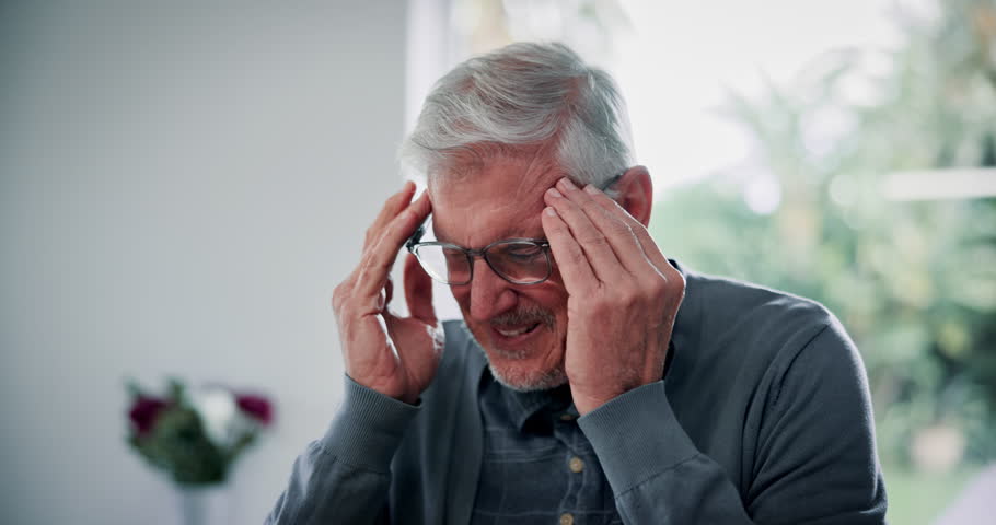 Senior man, laptop and shoulder pain with headache for bad posture, strain or pressure at home. Mature, male person and migraine with stress, muscle tension or tired with fibromyalgia or discomfort