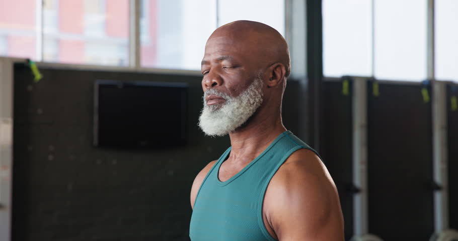 Gym, fitness and face of mature black man for training, exercise and workout for strength. Sports, serious and portrait of senior person for wellness, health and muscles for performance and endurance