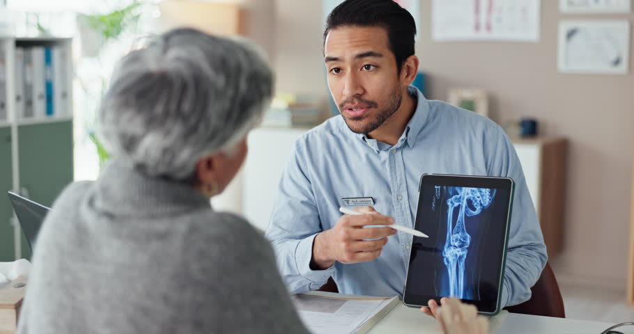 Consulting, doctor and documents with person for medical, osteoporosis or treatment plan. Healthcare, medicine and synthetic stem cell therapy with mature patient and bone marrow transplant trial