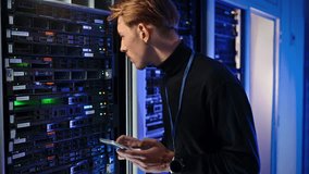 Man analysing data in a server room - Powered by Shutterstock - Get 15% off with code: PIKWIZARD15