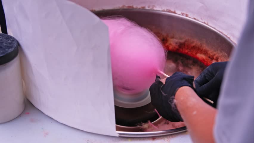 Caucasian Small Business Owner Preparing Sweet Sugar Candyfloss at Food Stall on City Boulevard