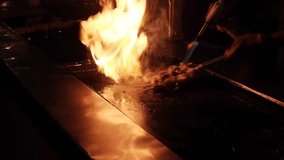 Experience the intense culinary action as a chef skillfully cooks seafood with large, bright flames. Perfect for highlighting dynamic cooking scenes and culinary artistry - Powered by Shutterstock - Get 15% off with code: PIKWIZARD15