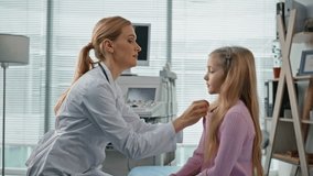 Smiling pediatrician giving high five to cute girl. Closeup child visit doctor measuring body temperature after illness in childcare clinic. Healthcare professional conducting patient consultation. - Powered by Shutterstock - Get 15% off with code: PIKWIZARD15