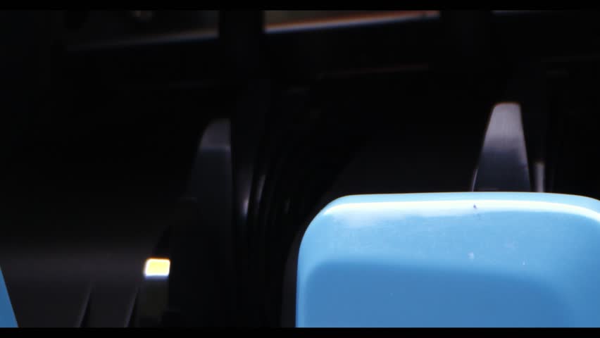 US Dollar bills being counted by a blue bill counter