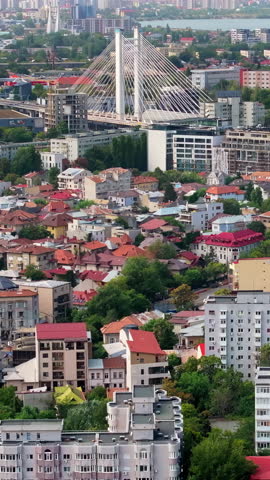 Aerial drone view of buildings around the Basarab Overpass bridge in Bucharest, Romania. Vertical
