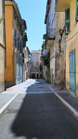 Buildings on sides of the street in Vallauris, France. Vertical