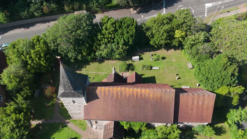 St. Peter the Apostle Church is situated on Belgrave Road in Seaford, surrounded by lush green trees in a sparsely populated area dominated by private residences.