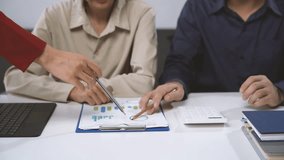 Business Analysis: A team of professionals collaborates over a spreadsheet and charts, analyzing data and strategizing for success. The image captures the intensity of their focus and the intricate de - Powered by Shutterstock - Get 15% off with code: PIKWIZARD15