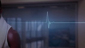 Animation of cardiograph over african american man drinking water at gym. Technology, sport and digital interface concept digitally generated video. - Powered by Shutterstock - Get 15% off with code: PIKWIZARD15