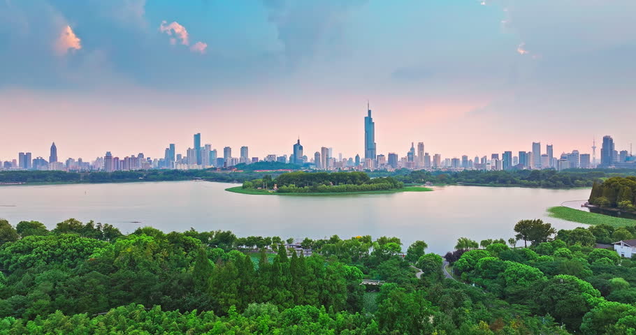 Aerial shot of modern city buildings skyline and lake in Nanjing, China
