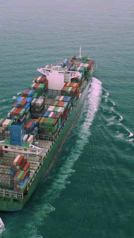 Aerial view of international containers cargo ship. Logistics, import and export concept.
