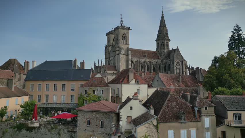 Medieval Fortress and Church in Burgundy, France, Aerial.Aerial Drone Flyover of Medieval City in Burgundy.