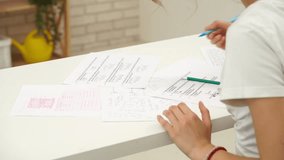 High school teenagers in classroom, close up shot girl writing math exam, doing tasks solving problems. Modern education concept. - Powered by Shutterstock - Get 15% off with code: PIKWIZARD15