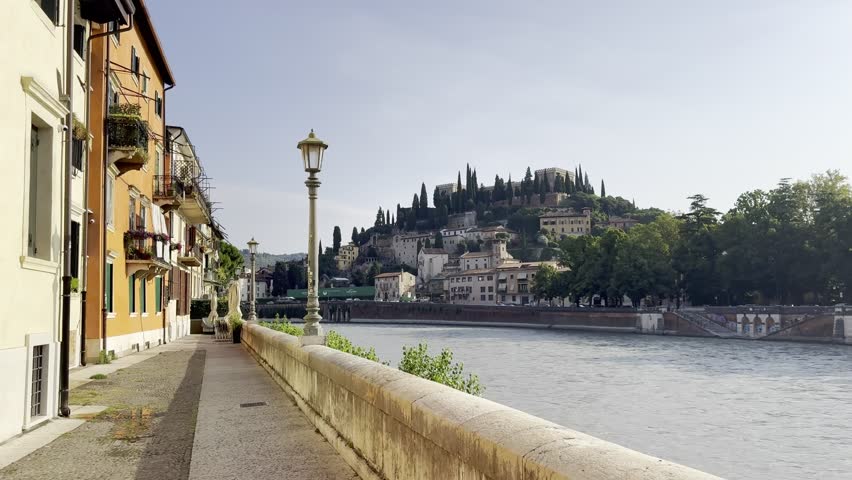 Serene view along quiet walkway on an early Monday morning in Verona, Italy